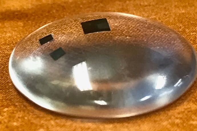 A flexible die mounted on a spherical surface